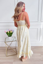 WISHLIST Avery triple bow floral midi dress featuring a flowy silhouette and vibrant floral pattern, perfect for dressy occasions.