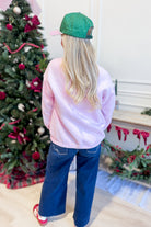Vintage Santa Pink French Terry Sweatshirt from PEACH LOVE featuring a 137 graphic design.