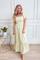 IN LOOM Bloom floral square neck maxi dress displayed on a model, featuring a flowy silhouette and vibrant floral pattern.