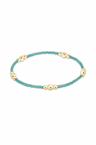 Enewton sea glass gold bracelet featuring hope and purpose charms, elegant jewelry accessory with sea glass and gold accents.