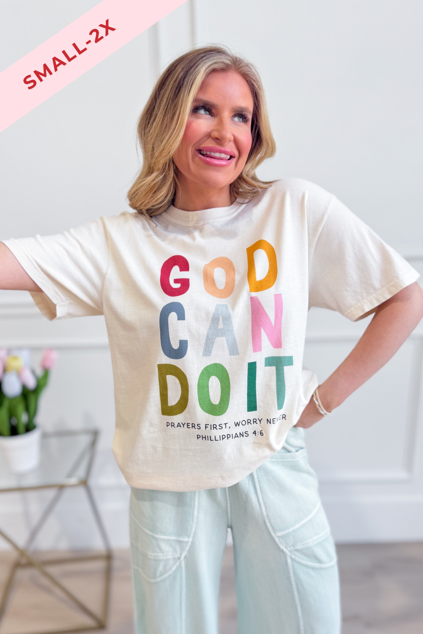 Poppy & Pine God Can Do It graphic T-shirt featuring inspirational text and a casual fit, displayed on a plain background.