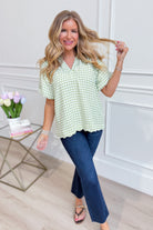 UMGEE USA Rowan Sage plaid puff sleeve top with a fitted bodice and stylish short puff sleeves, featuring a printed pattern.