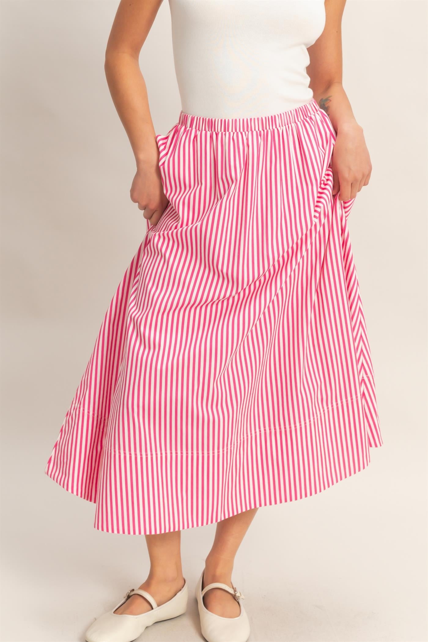 HYFVE Tammy pin-striped midi skirt with a high waist and flowing A-line silhouette, featuring vertical navy and white stripes.