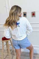 Peach Love Benny USA graphic pullover sweatshirt with bold 137 graphic print in black and white on soft fabric background.