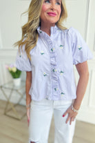Striped ruffled button-down top with floral embroidery by &MERCI, featuring a stylish, dressy design perfect for elegant casual wear.