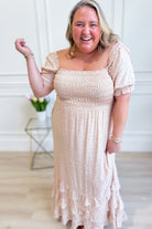 IN LOOM Luna smocked floral maxi dress with a flowy silhouette, featuring a smocked bodice and vibrant floral pattern.
