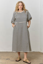 Rebecca navy striped midi dress by BAEVELY, featuring a stylish, flowy design with a fitted waist and classic stripe pattern.