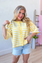 Lauren yellow striped button-down cardigan top from BAEVELY, featuring a spring sweater with yellow and white stripes.