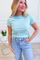 Wishlist Finley contrast striped top, a stylish 110 dressy top with bold stripe pattern, displayed on a hanger.