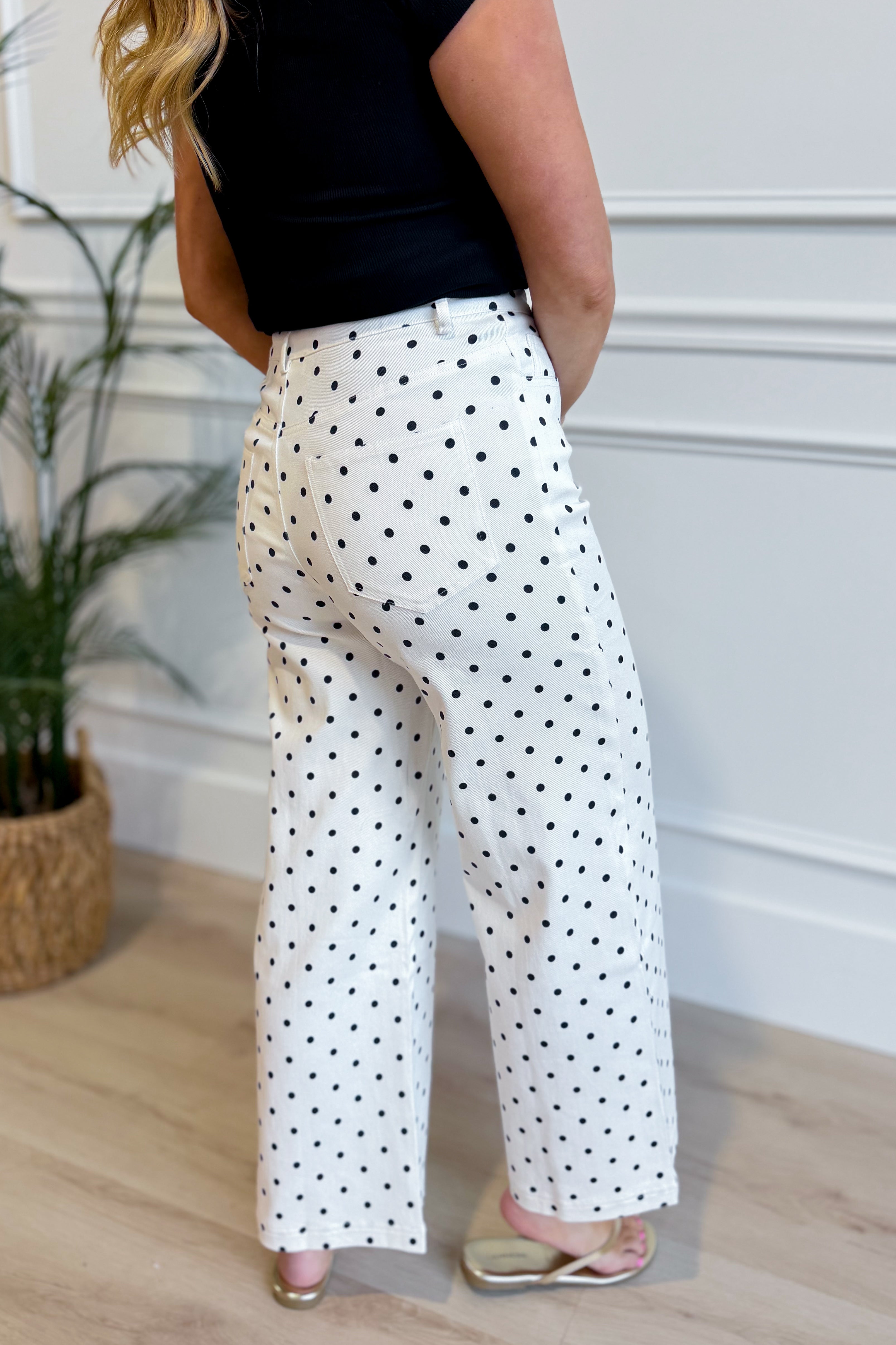 ENTRO Oscar Polka Dot Wide Leg Pant, 156 pants with black and white polka dot pattern, flowing wide-leg style on a model.