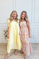 Umgée USA Tonya plaid printed midi dress with long sleeves and a fitted waist, perfect for dressy occasions.