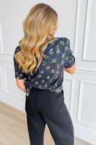 Jodifl Lonny floral printed dressy top with vibrant flower pattern, long sleeves, and lightweight fabric.