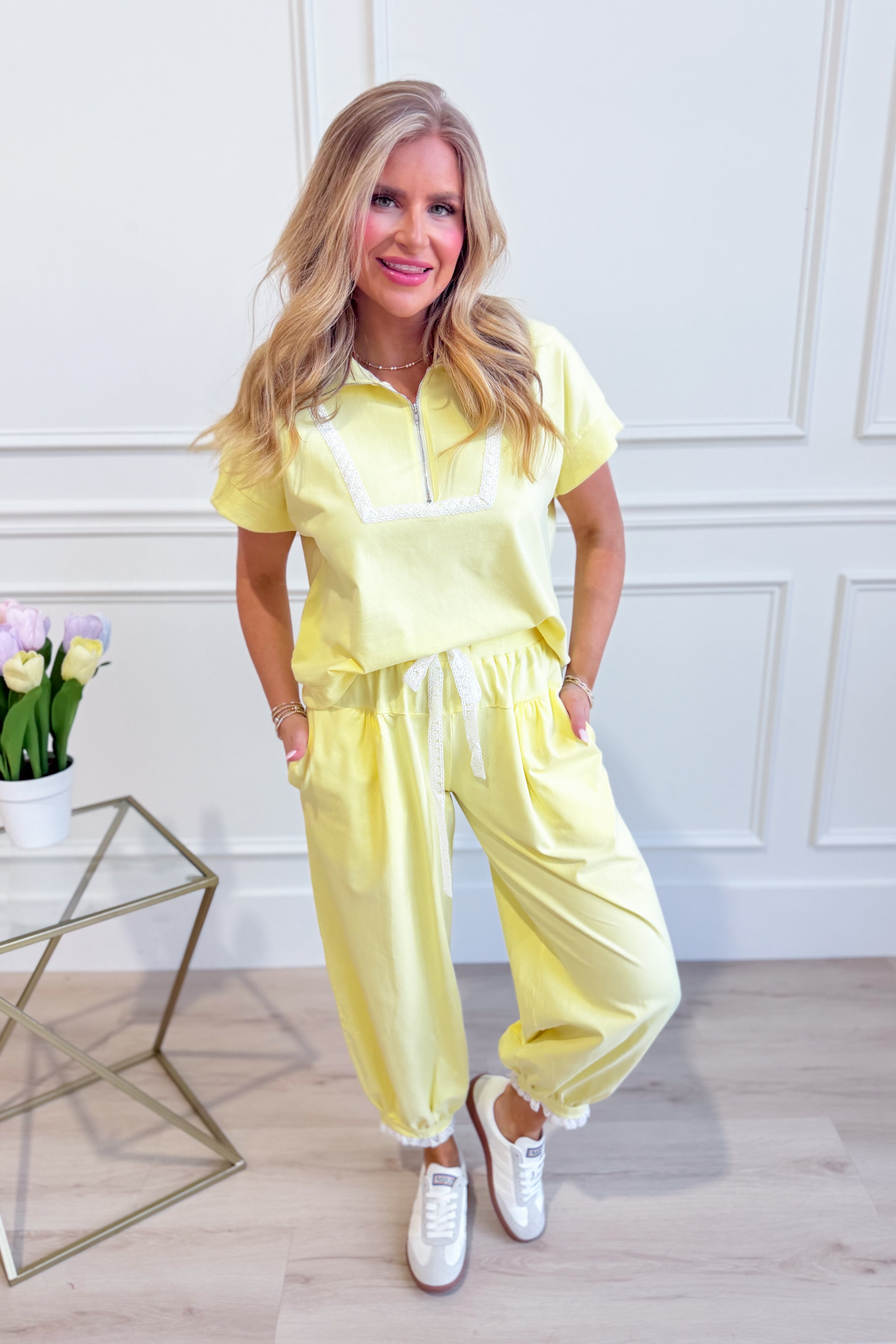 EE:SOME Emily Lace Hem Jogger Pant in 156 Pants with stylish lace hem and comfortable fit, shown in a casual pose.