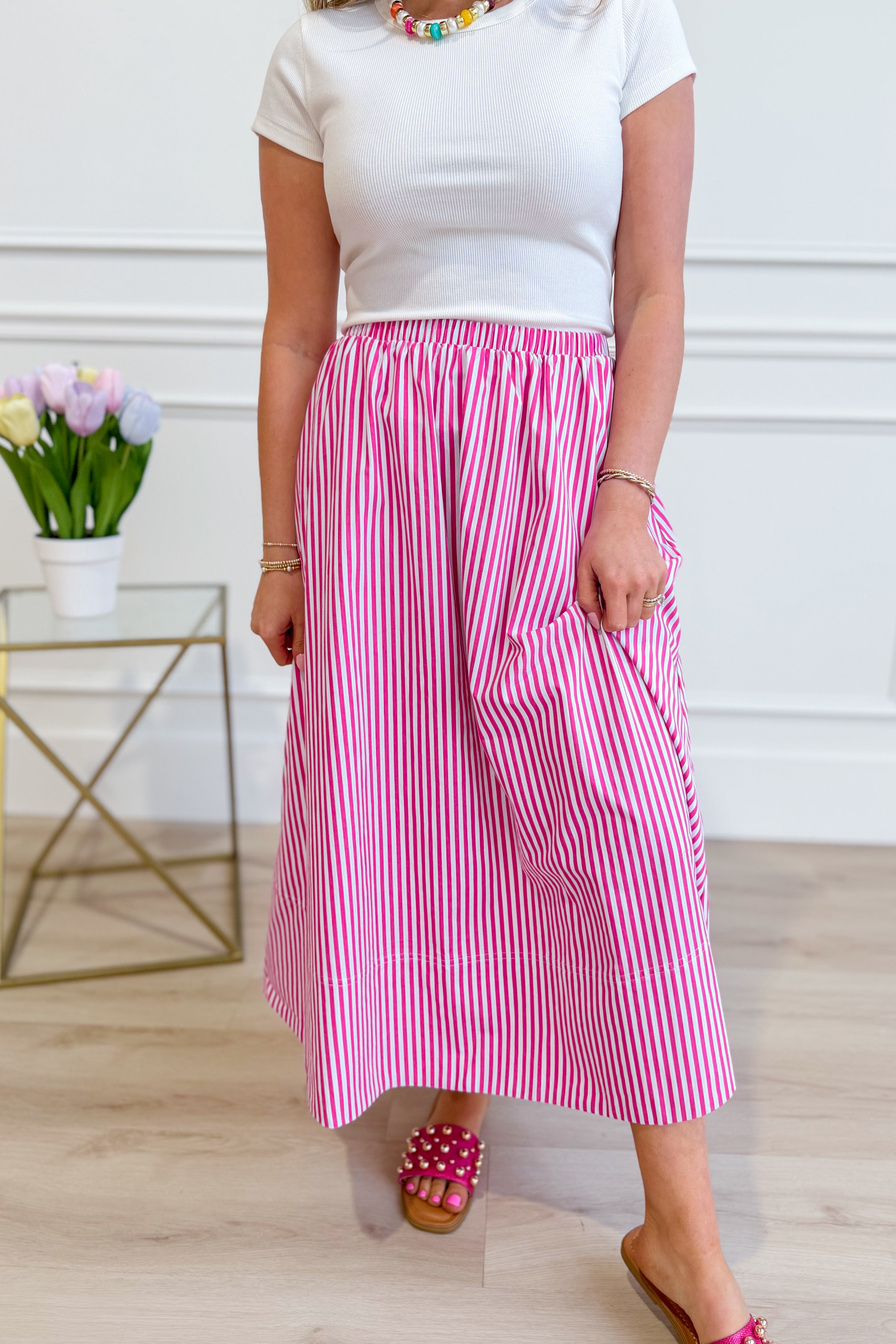 HYFVE Tammy pin-striped midi skirt with a fitted waistband and flowing length, featuring classic vertical stripes.