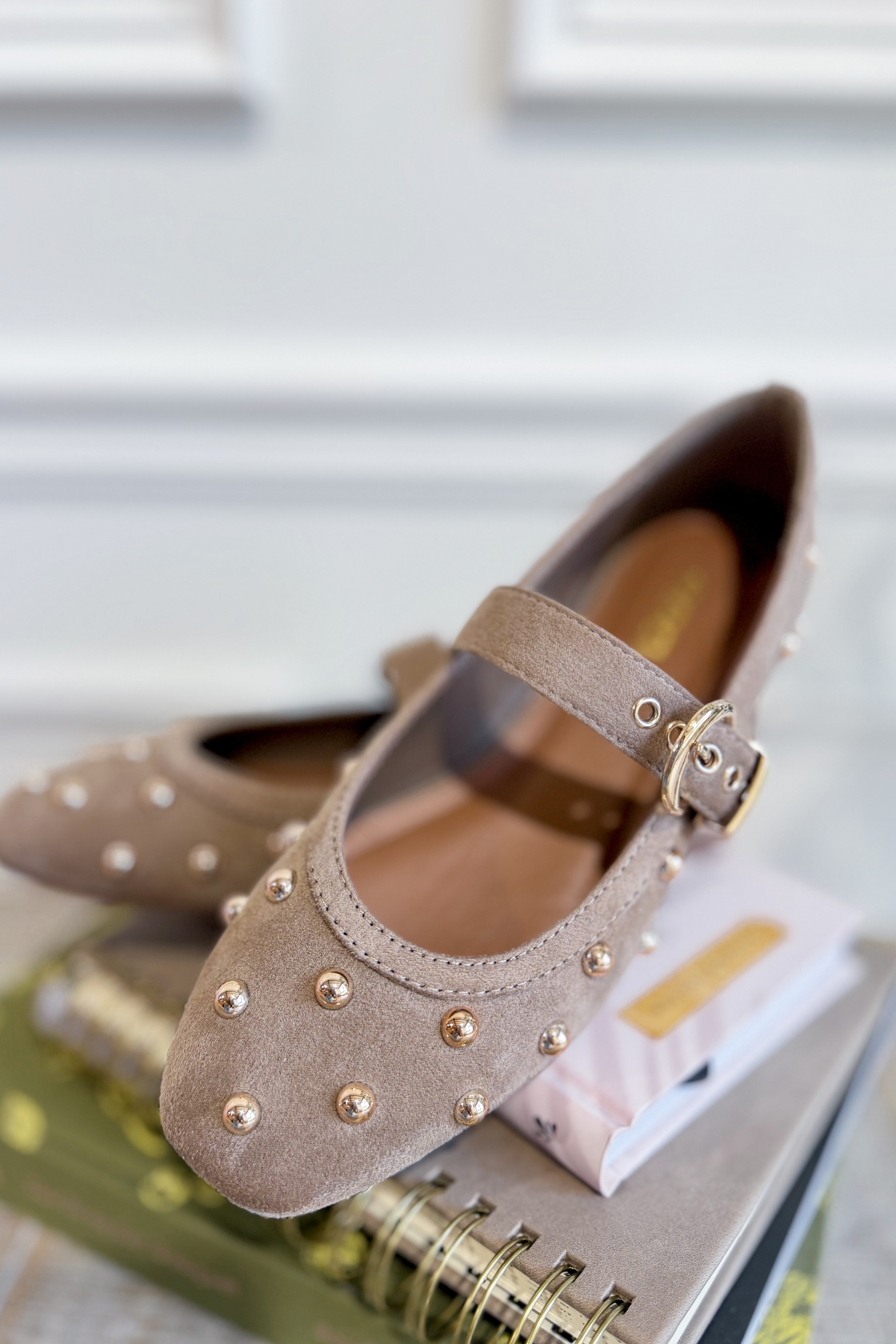 OLEM Mayhap studded flat slip-on shoes with multiple small studs, black fabric upper, and comfortable slip-on design.