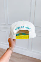 ETTA & EAST Living On A Dream trucker hat with mesh back and embroidered logo, casual accessory for everyday wear.