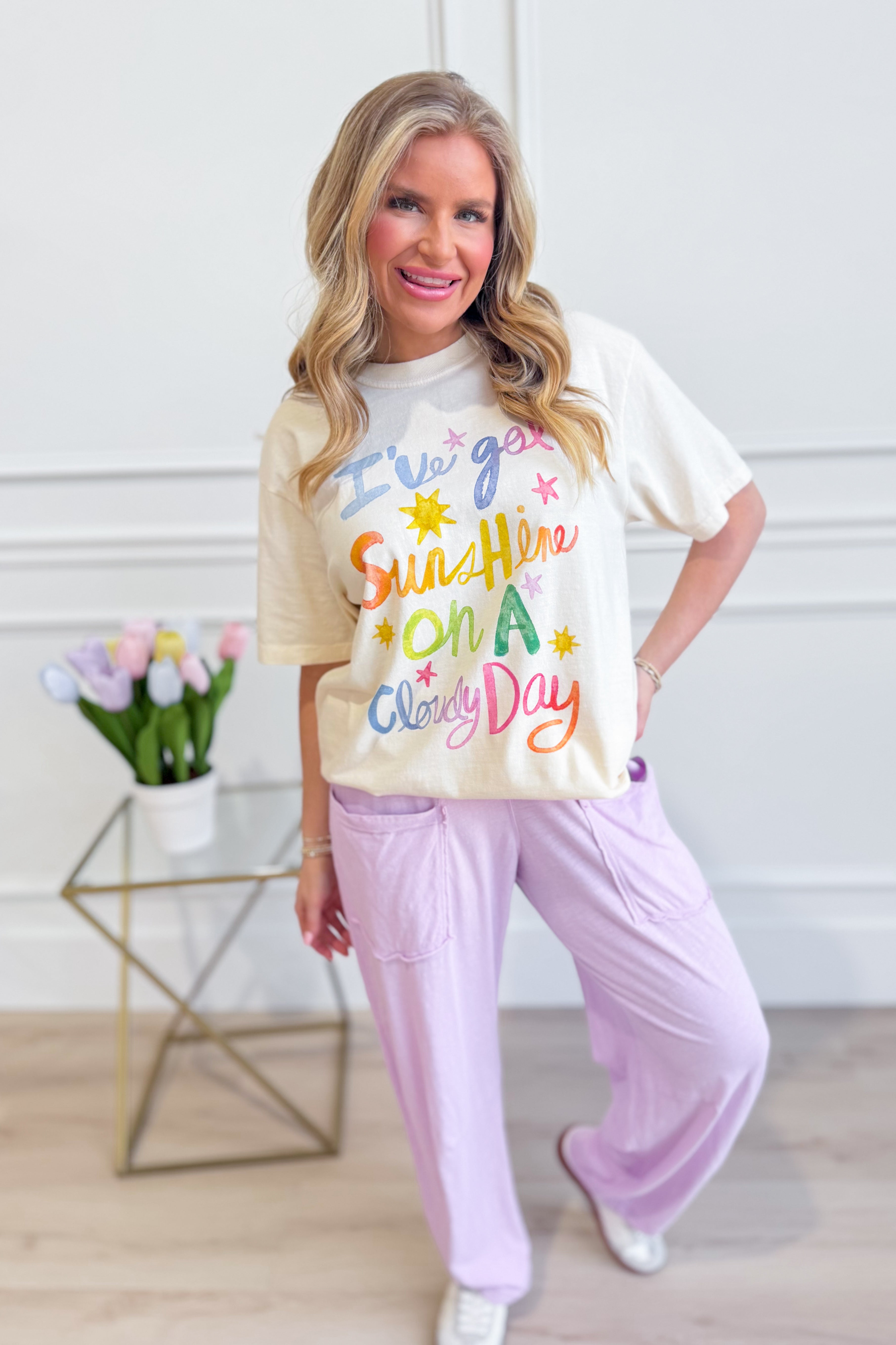 Poppy & Pine Ive Got Sunshine graphic T-shirt featuring bright sun and cloud illustrations on soft cotton fabric.