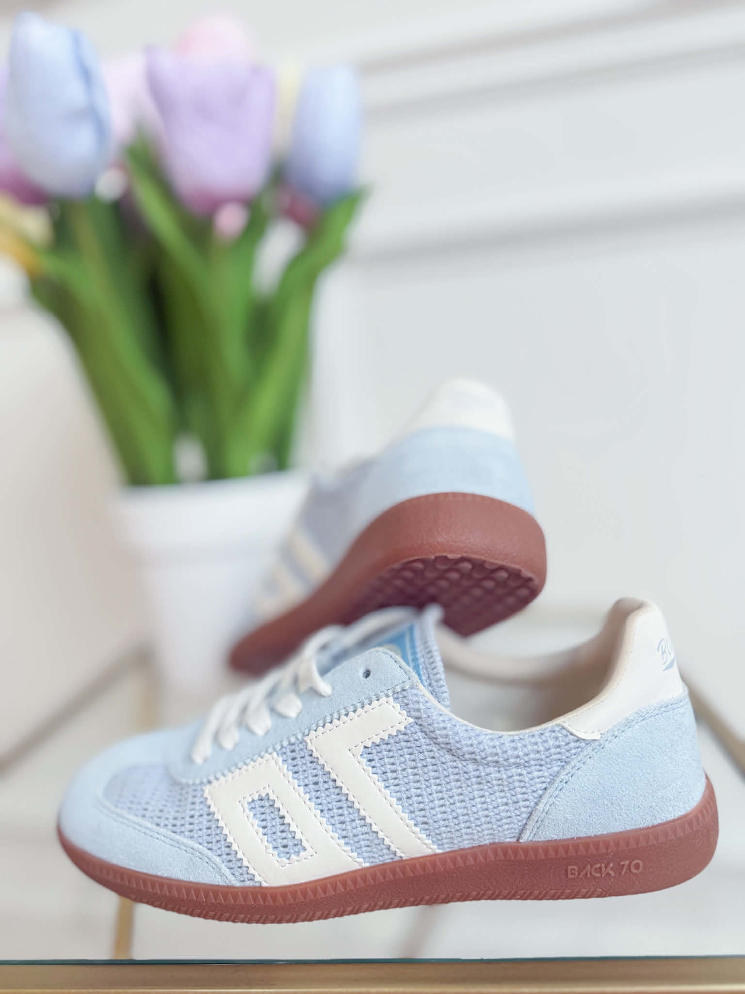 BACK70 Ghost Sneakers in Sky Blue, 205 style, featuring sleek design and vibrant color, displayed on a plain background.