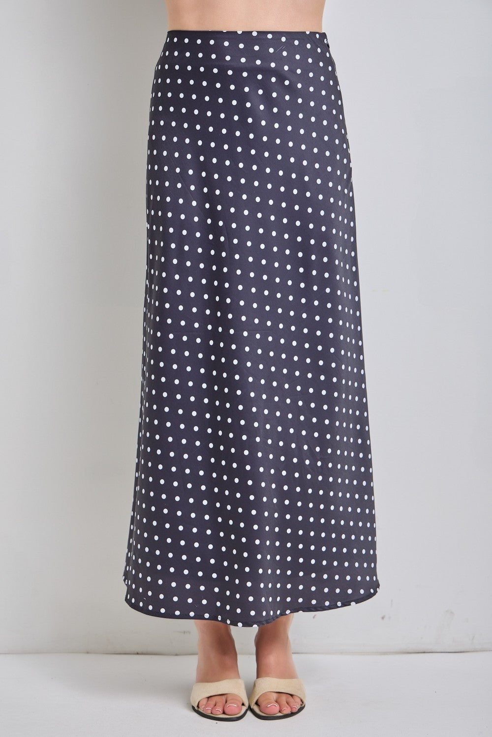 Black polka dot midi skirt from BAEVELY's Lucy collection, featuring a flowy design and classic pattern.