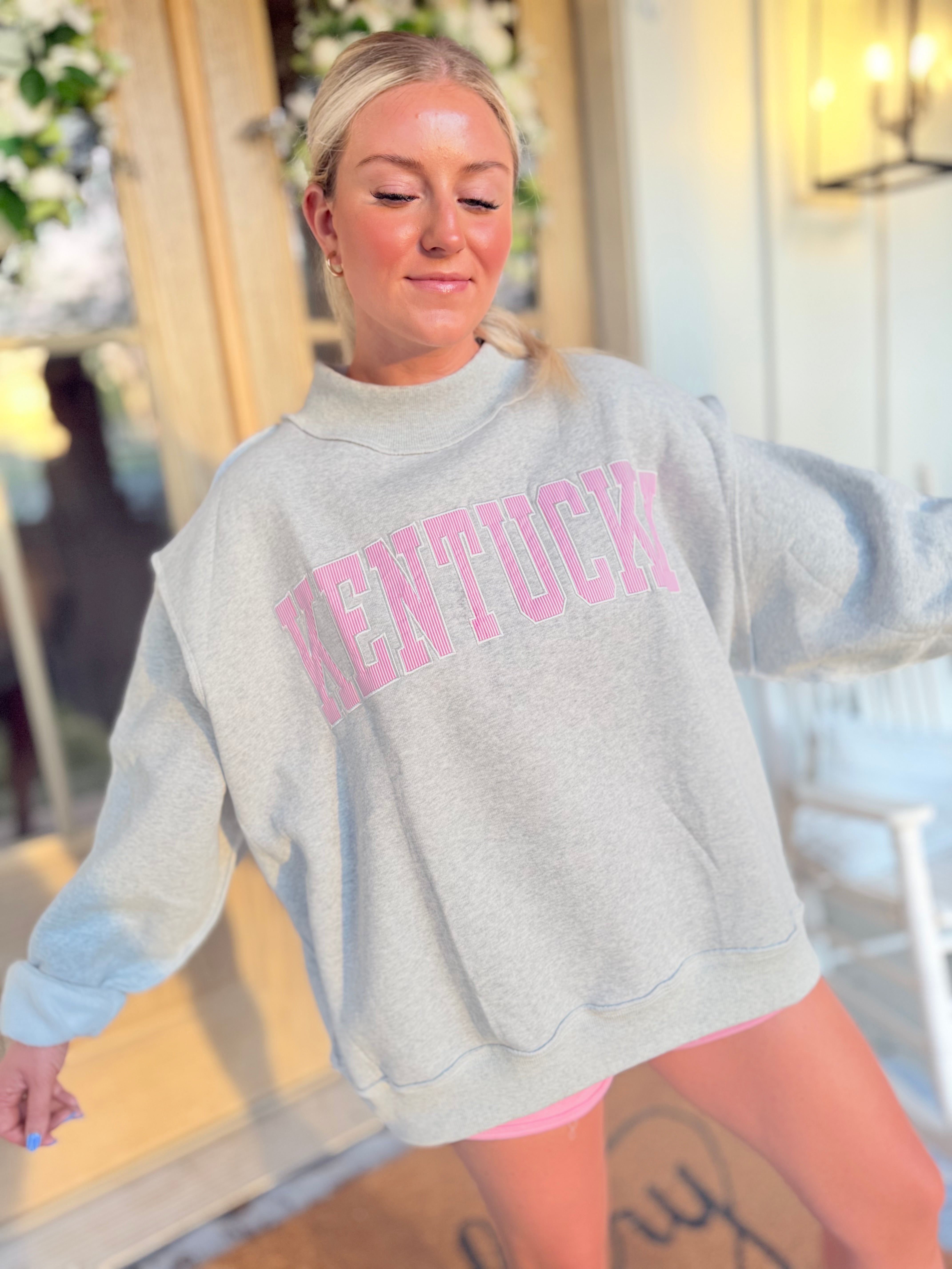 Kentucky Pink Striped Mock Embroidered Sweatshirt from BUCKET LIST 137 Graphic Sweatshirts collection, featuring pink stripes and embroidered details.
