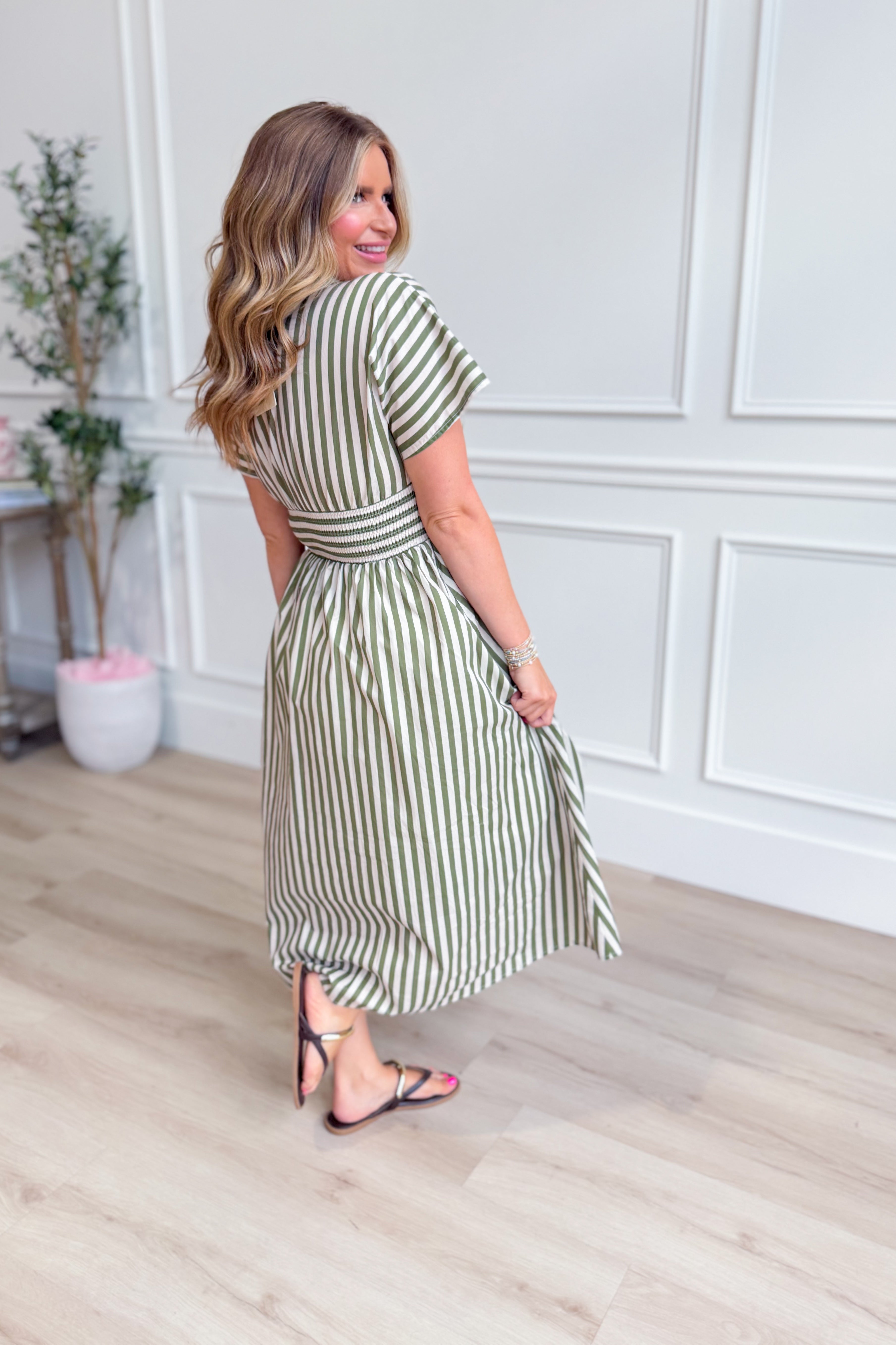 ENTRO Kristen olive striped zip-up midi dress, featuring a fitted silhouette and stylish color pattern, perfect for dressy occasions.