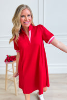 Uptown casual Skye Ruffle Trim Dress by UMGEE USA featuring ruffle details and a relaxed fit, displayed on a hanger.