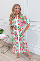 ENTRO Kristy floral printed short sleeve dress with a fitted waist and vibrant flower pattern, perfect for dressy occasions.