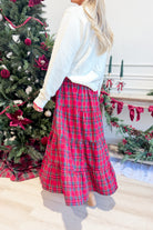 TWENTIFOURTH Sutton plaid tiered midi skirt with a flowing silhouette and classic plaid pattern, shown on a model.