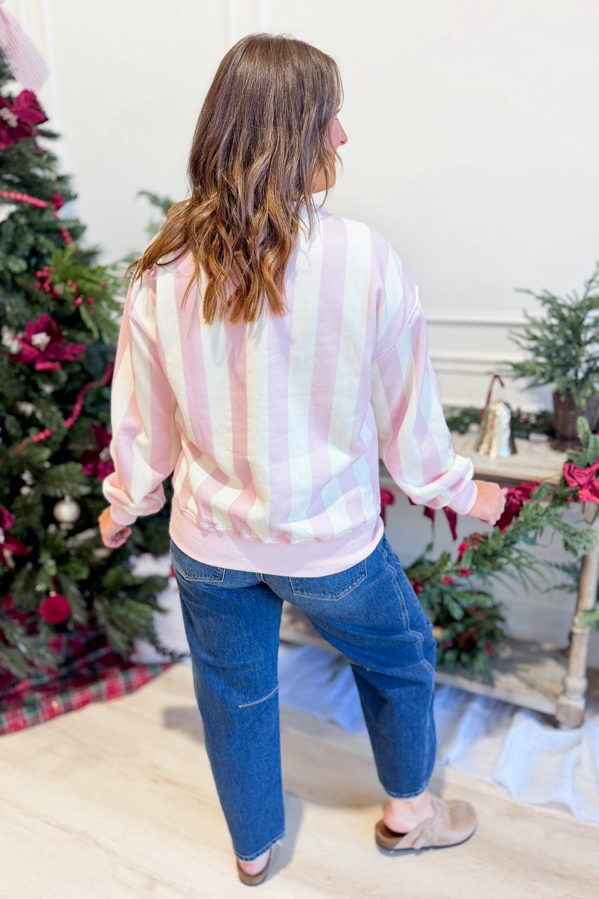 PEACH LOVE Serena wreath and striped graphic sweatshirt featuring vibrant colors and cozy fit, perfect for casual wear.