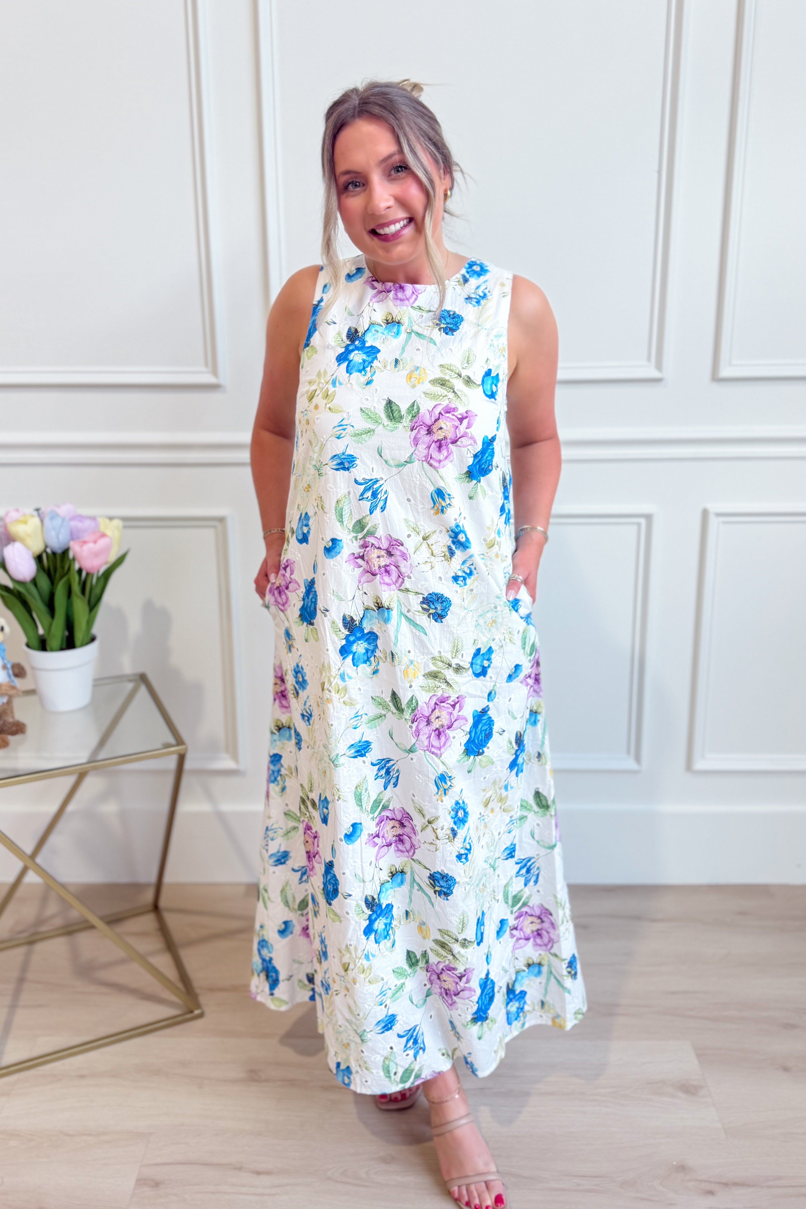 ENTRO Zoe blue botanical floral midi dress with long sleeves and a fitted waist, featuring a vibrant floral pattern on lightweight fabric.