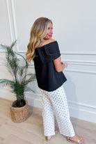 TCEC Oneita bow accented off-the-shoulder top in a dressy style, featuring a bow detail and off-shoulder design.