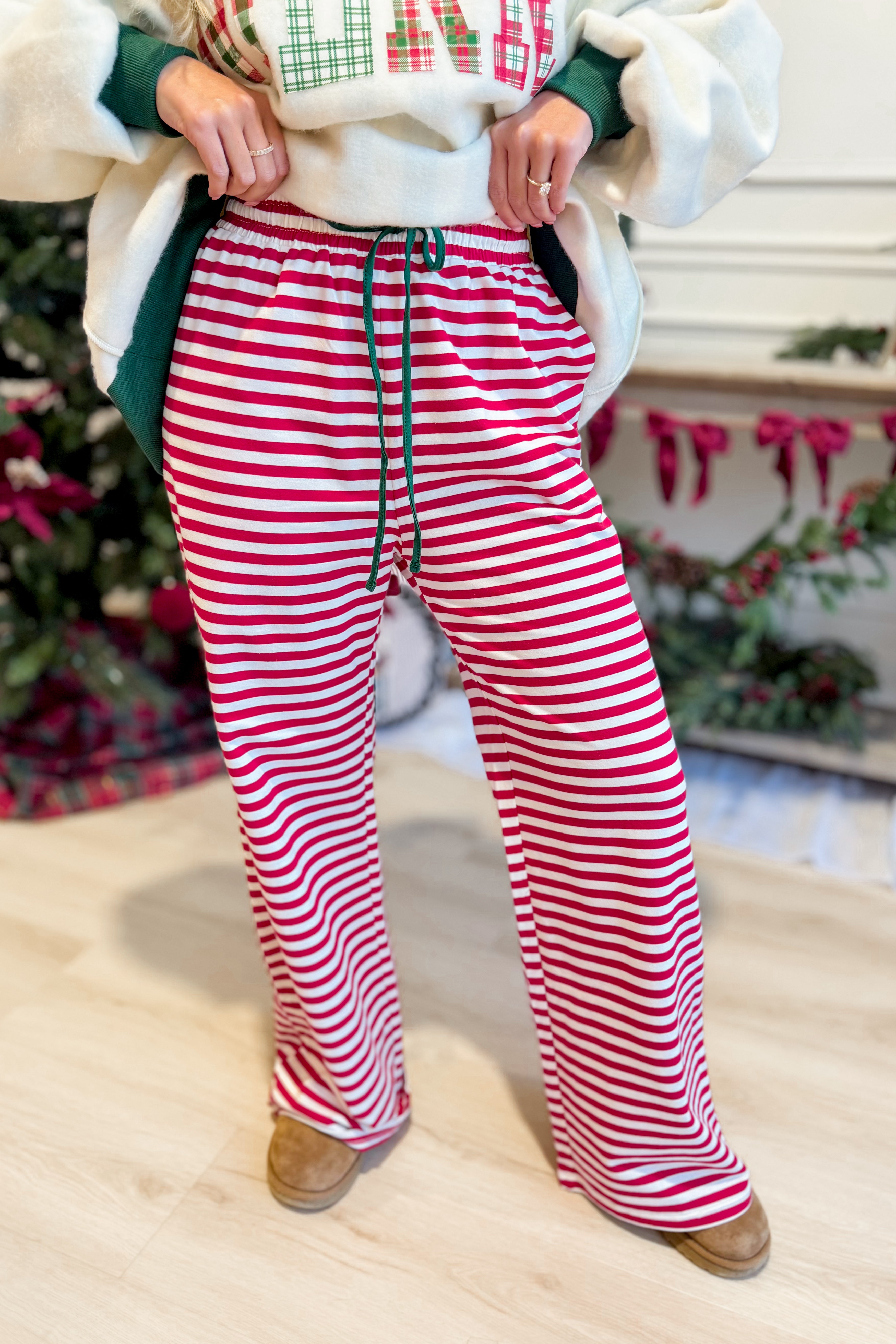 Rudy Red Striped Holiday Pants by BUCKET LIST, stylish 156 pants with festive red and white stripes for holiday wear.