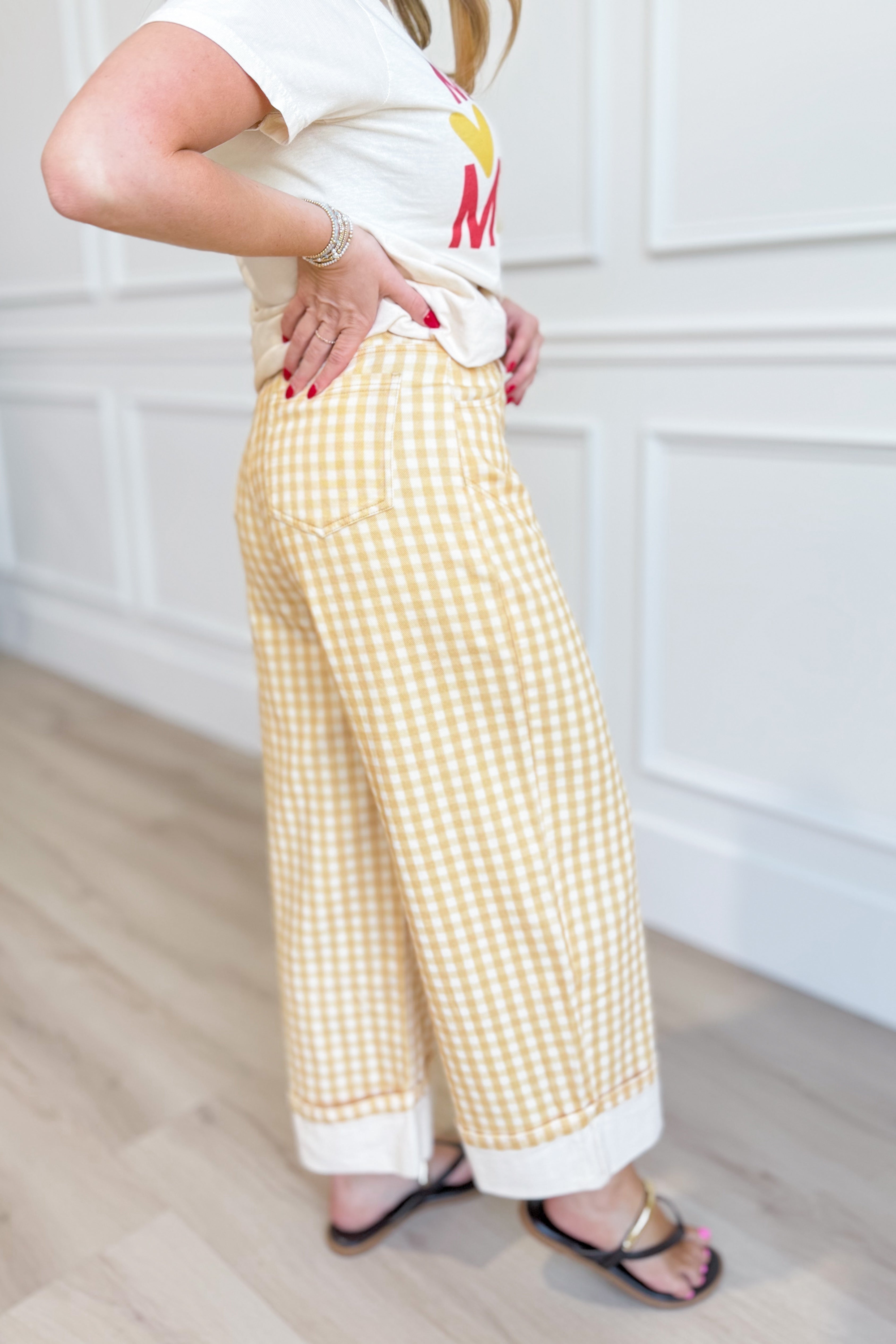 Yellow gingham barrel pants from PEACH LOVE featuring rolled hems, styled as casual novelty jeans.