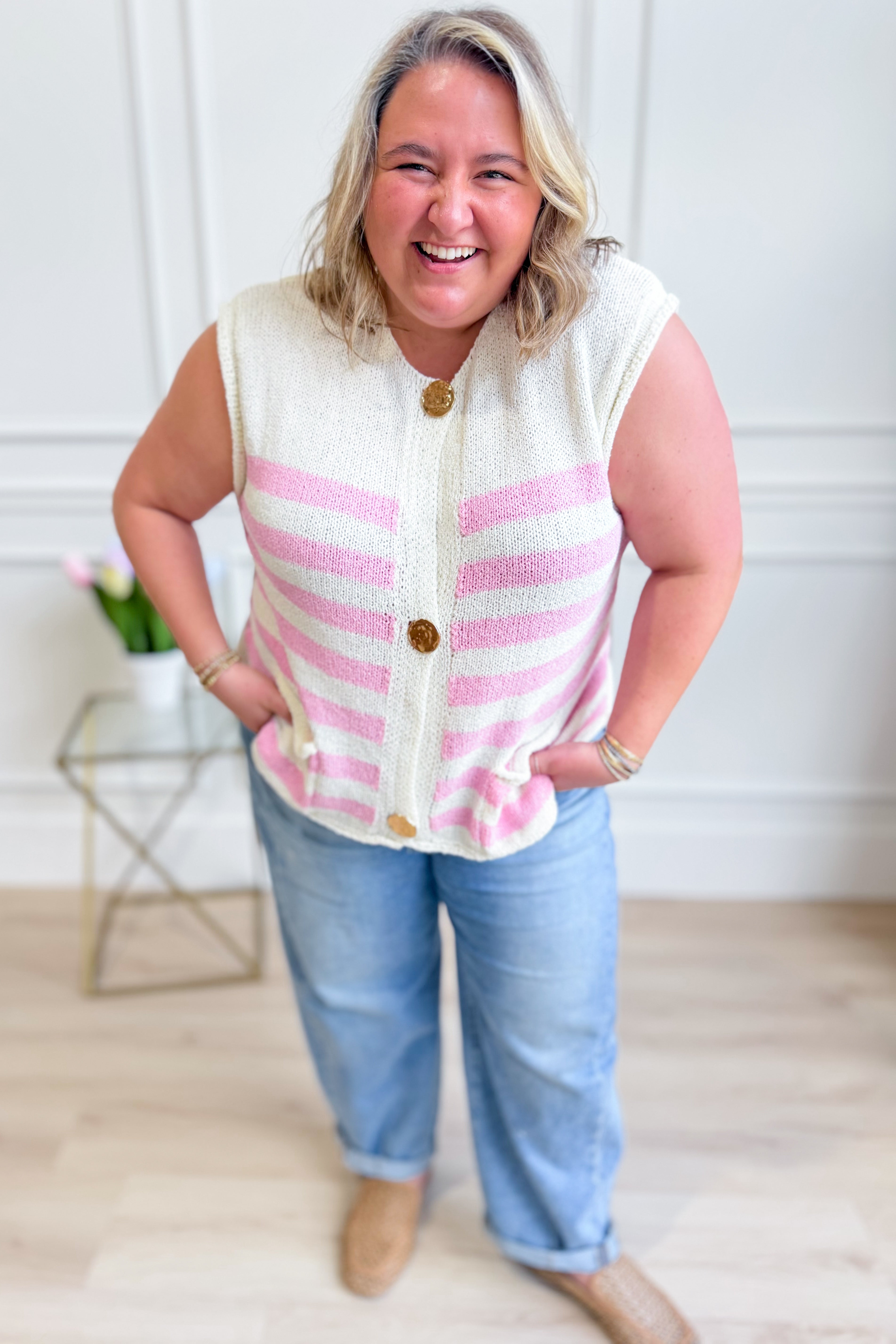 Carrie striped sleeveless sweater top by SHE + SKY, stylish 131 Spring sweater, featuring colorful horizontal stripes and a fitted design.