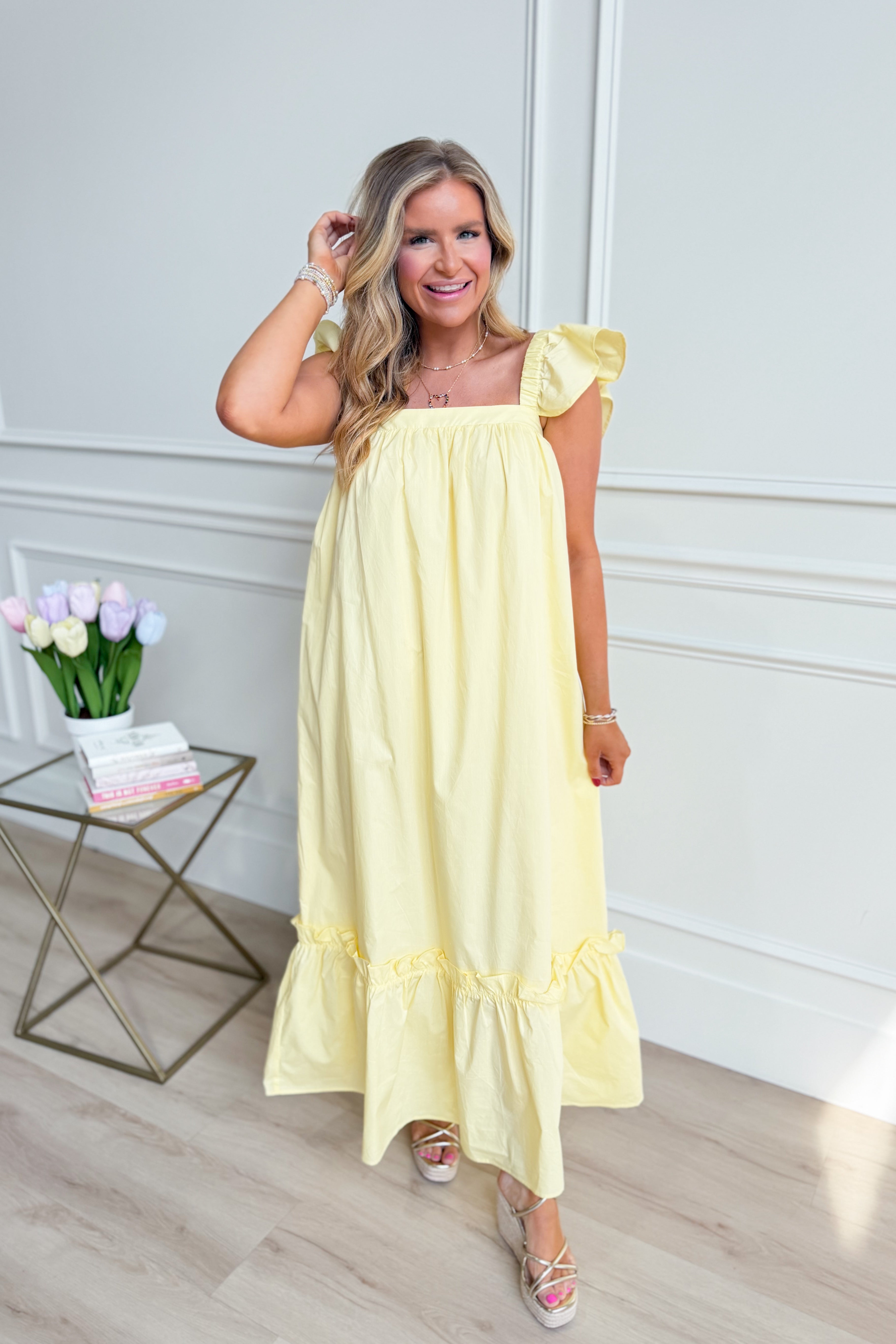 TCEC Folly Butter Flutter Sleeve Midi Dress in soft fabric with flutter sleeves, casual style, light-colored, knee-length.