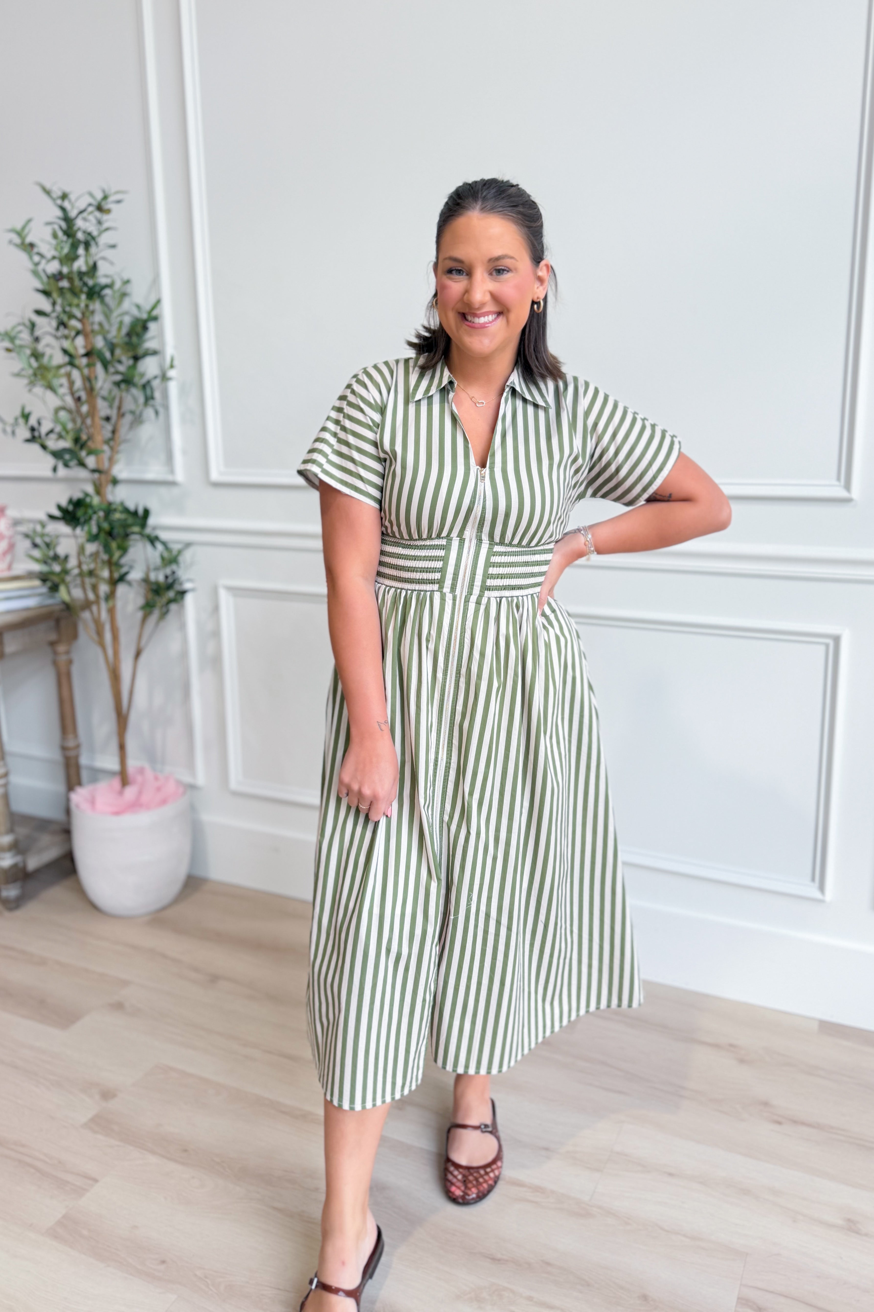 Kristen Olive Striped Zip-Up Midi Dress by ENTRO, featuring a fitted silhouette with green and white stripes and a front zipper.