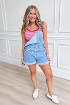 Peach Love Holly polka dot denim overall romper for women, featuring adjustable straps and playful polka dot pattern.