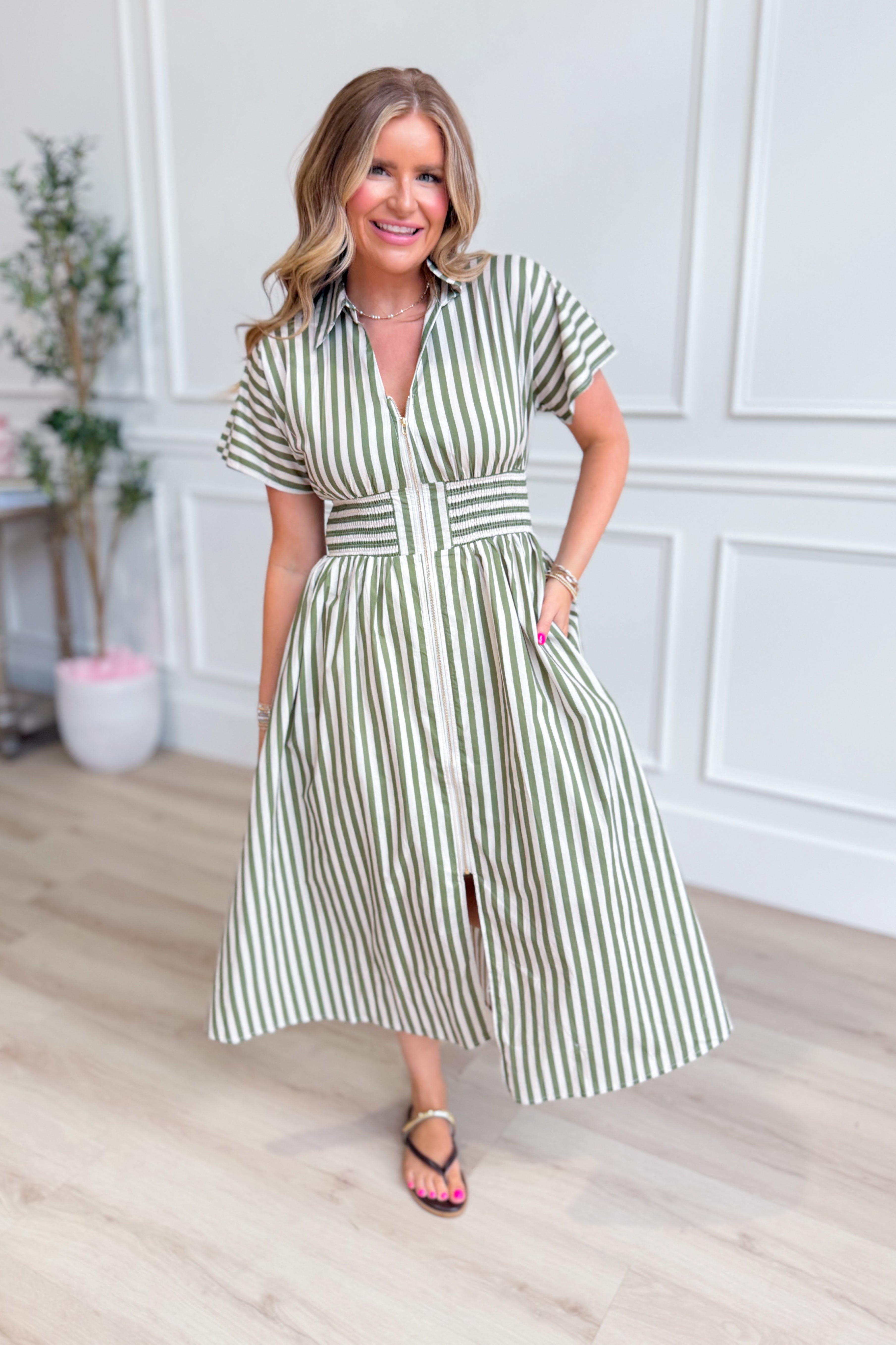 Kristen olive striped zip-up midi dress by ENTRO, featuring a fitted silhouette and casual yet elegant style.