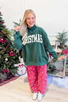 Red Christmas-themed mock neck sweatshirt from BUCKET LIST's 137 Graphic Sweatshirts collection, featuring festive design details.