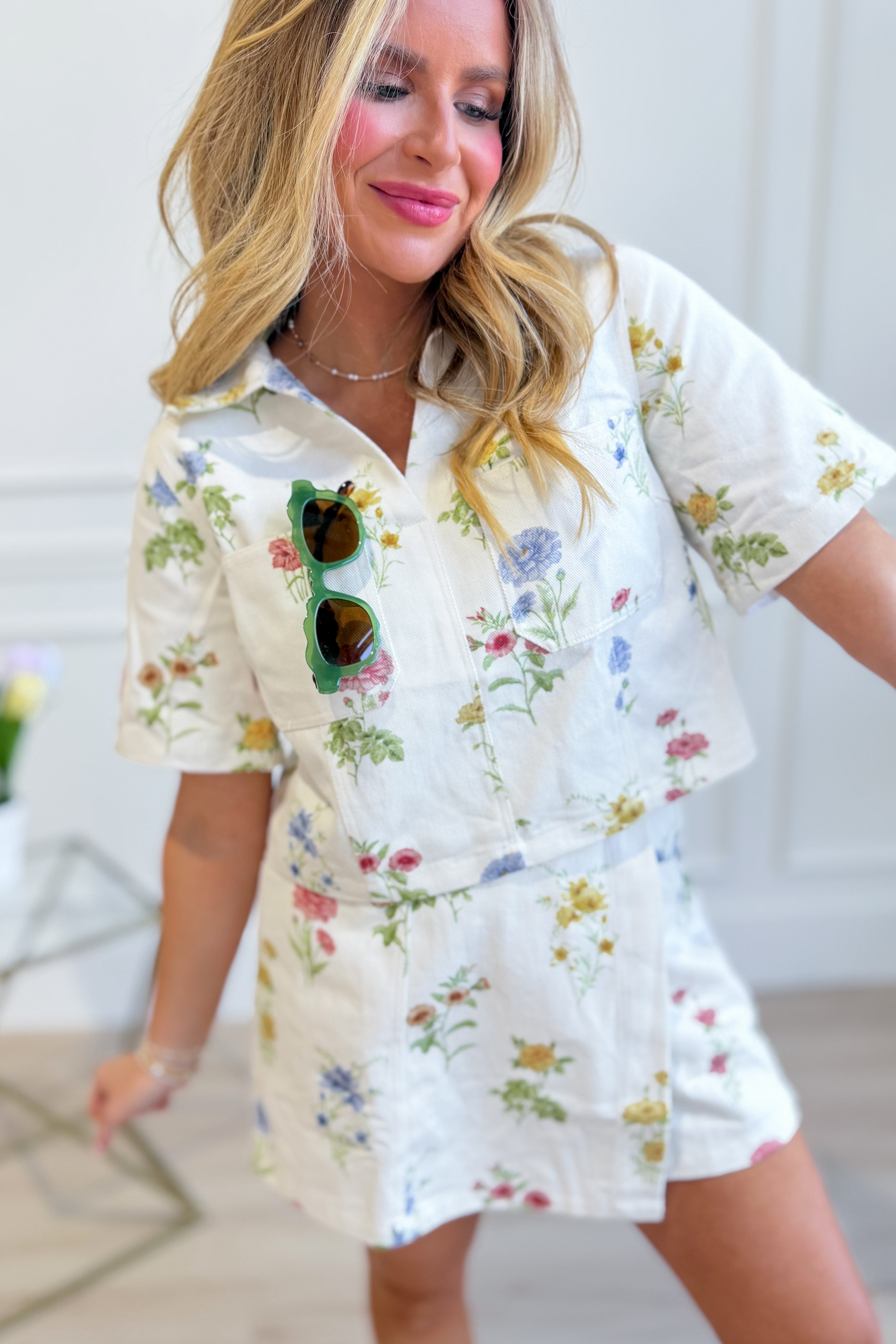 Sadie floral printed collared top by ENTRO, a stylish 110 dressy top with vibrant floral patterns and a classic collar design.