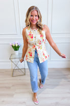 Baevly Mia floral printed button-up vest styled as a dressy dress with vibrant floral pattern and sleeveless design.