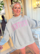 Kentucky Pink Striped Mock Embroidered Sweatshirt from BUCKET LIST, casual graphic sweatshirt with pink stripes and embroidered details.