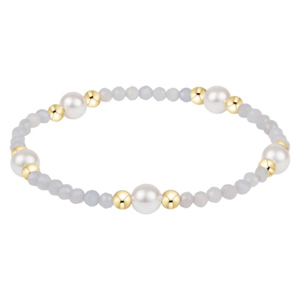 Enewton 6mm aquamarine pearl gold bracelet featuring aquamarine and gold beads on a delicate jewelry strand.