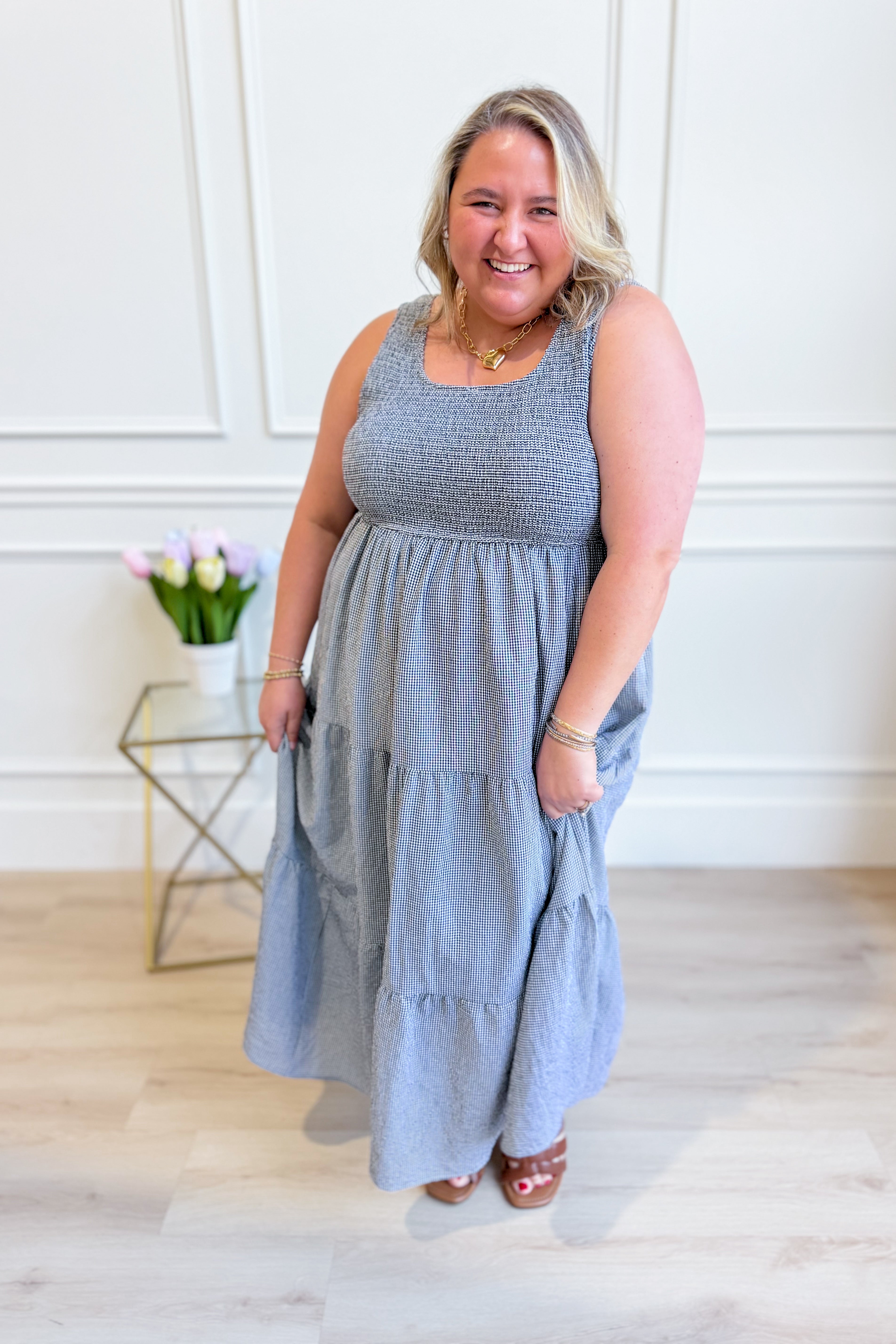 Baevely painter gingham midi dress with a fitted bodice and flowing skirt, styled with short sleeves and a classic pattern.