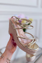 Berness Rhea Gold Wedge Sandal featuring a stylish gold strap and comfortable wedge heel for women’s summer footwear.