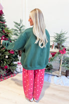Bucket List Christmas mock neck sweatshirt featuring festive graphic design, cozy long sleeves, and soft fabric for holiday comfort.