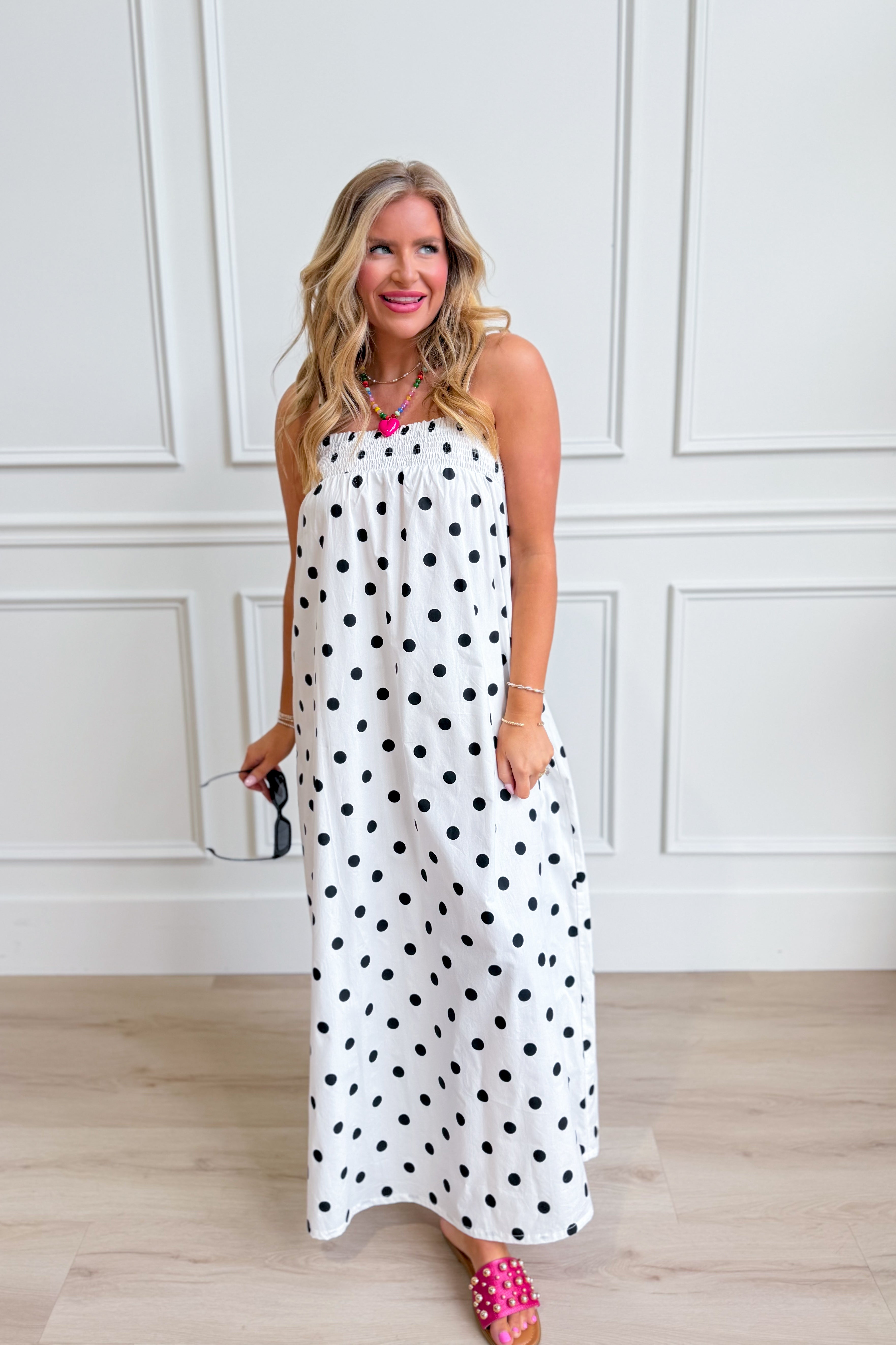 Laney Polka Dot Maxi Dress by THINGS BETWEEN featuring a flowing silhouette and classic polka dot pattern, perfect for dressy occasions.