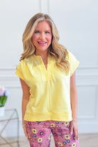 ENTRO Marian split neck casual top, 105 casual tops, featuring a relaxed fit and stylish design in light fabric.