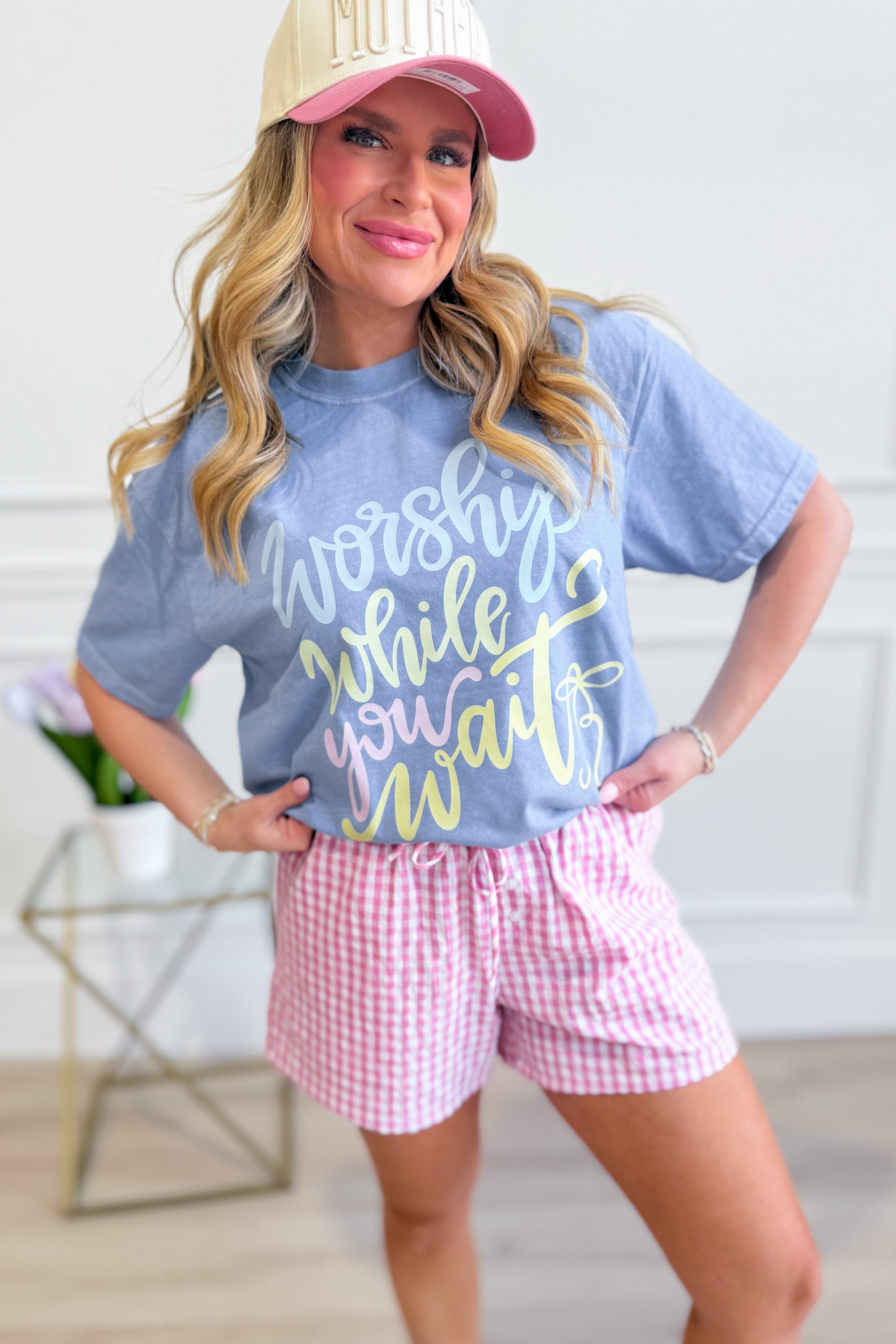 DASH FORWARD Worship While You Wait graphic T-shirt featuring bold text design on black cotton tee.