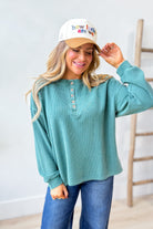 BLU PEPPER Cindy ribbed henley long sleeve top in a casual style, featuring a buttoned neckline and fitted ribbed fabric.